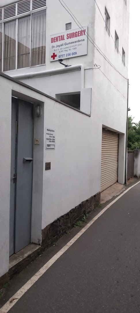 Exterior wall with Dental Surgery sign and street entrance